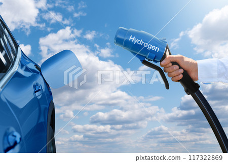 Man holds a hydrogen fueling nozzle. Refueling car with hydrogen fuel 117322869