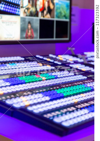 Professional video and sound mixer control panel with buttons and sliders Professional video and sound mixer control panel with buttons and sliders 117323392