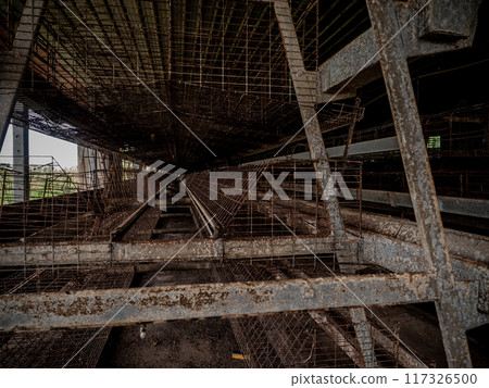 The empty laying cages of poultry houses, old, decayed, abandoned The empty laying cages of poultry houses, old, decayed, abandoned 117326500