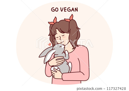Little vegan older girl hugs rabbit that they wanted to use for food and cook for dinner 117327428
