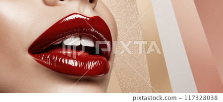 Woman with red lipstick is showing her white teeth on a gold banner background with copy space Woman with red lipstick is showing her white teeth on a gold banner background with copy space 117328038