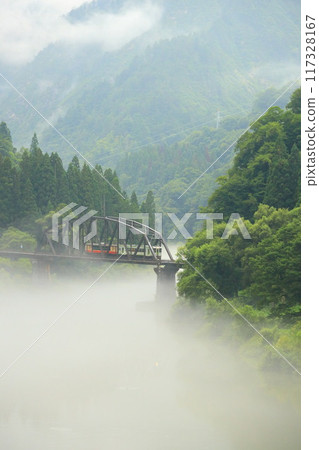 Tadami Line running in fog Tadami Line running in fog 117328167