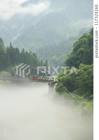 Tadami Line running in fog Tadami Line running in fog 117328168