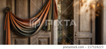 Luxurious velvet fabric hanging on a wooden door creating an elegant background for copy space banner 117328223