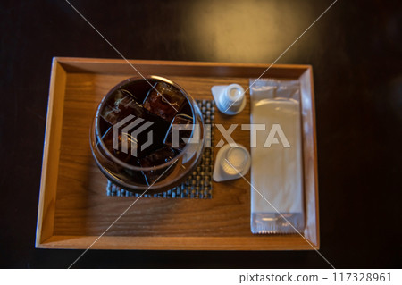 Ice Americano black coffee with sugar syrup and milk cream cup 117328961