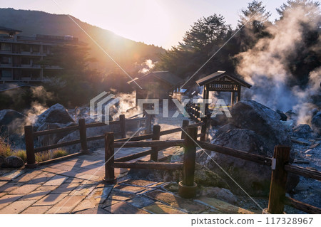 Mount Unzen Hell valley Jigoku by hotel and hot springs at sunset 117328967