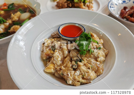 stir fried Oyster omelette with egg and spicy sauce.  Thai food 117328978