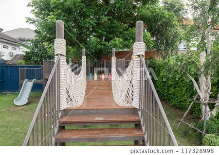 rope bridge trailing of childern playground at outdoor cafe rope bridge trailing of childern playground at outdoor cafe 117328998