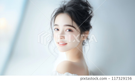 Smiling woman with glowing skin 117329156