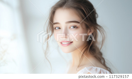 Smiling woman with glowing skin 117329157