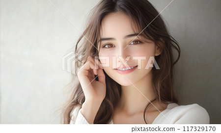 Smiling woman with glowing skin 117329170