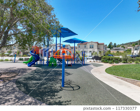 Colorful children playground activities in community public park  117330377