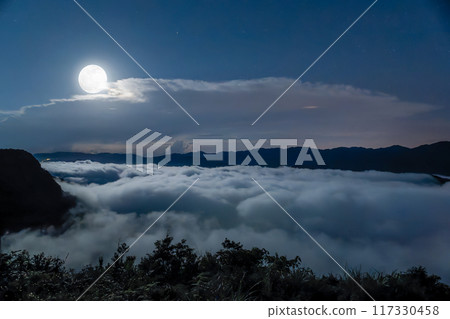 Tranquil Moonlit Sea of Clouds in Xindian, Taiwan. 117330458