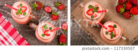 Glass of strawberry yogurt or smoothie with mint leaves on old wooden background. Top view 117330507