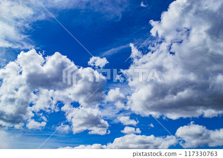 Magnificent cumulus clouds high in blue sky Magnificent cumulus clouds high in blue sky 117330763