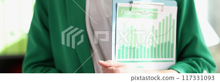 Female manager holding financial documents with charts and graphs Female manager holding financial documents with charts and graphs 117331093