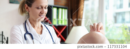 Woman doctor trichologist examining male patient with hair loss problem Woman doctor trichologist examining male patient with hair loss problem 117331104