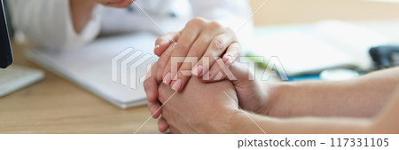 Female doctor hand holding patient empathy, support and compassion Female doctor hand holding patient empathy, support and compassion 117331105