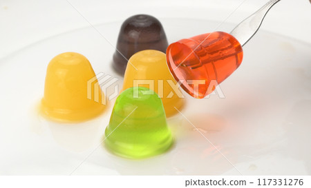 High angle view of assorted homemade small delicious fruit jelly. High angle view of assorted homemade small delicious fruit jelly. 117331276