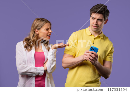 Woman spying on boyfriend chats with smartphone. Jealousy, curiosity, mistrust 117331394