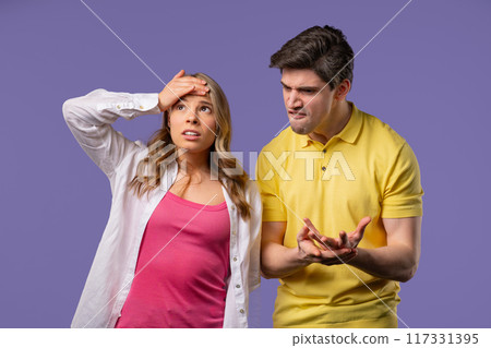 Young Man Screaming On Wife Or Girlfriend On Violet.Couple Relationships,Quarrel 117331395