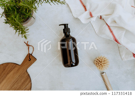 Brown bottle mockup for of natural dish detergent in kitchen Brown bottle mockup for of natural dish detergent in kitchen 117331418