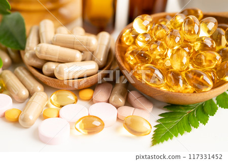 Alternative medicine herbal organic capsule with vitamin E omega 3 fish oil, mineral, drug with herbs leaf natural supplements for healthy good life. Alternative medicine herbal organic capsule with vitamin E omega 3 fish oil, mineral, drug with herbs leaf natural supplements for healthy good life. 117331452