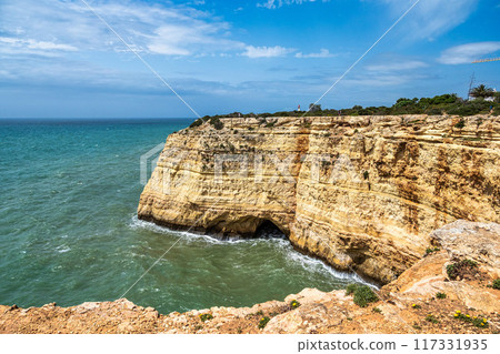 Portuguese coast in Benagil, Algarve, Portugal. Peninsula. Seven Hangging Valleys Trail. Portuguese coast in Benagil, Algarve, Portugal. Peninsula. Seven Hangging Valleys Trail. 117331935