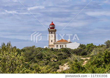 Portuguese coast in Benagil, Algarve, Portugal. Alfanzina Lighthouse. Seven Hangging Valleys Trail. Portuguese coast in Benagil, Algarve, Portugal. Alfanzina Lighthouse. Seven Hangging Valleys Trail. 117331936