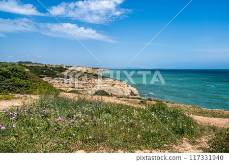 Portuguese coast in Benagil, Algarve, Portugal. Praia do Carvalho. Seven Hangging Valleys Trail. 117331940