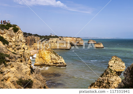Praia da Marinha Beach among rock islets and cliffs seen from Seven Hanging Valleys Trail, Algarve, Portugal 117331941