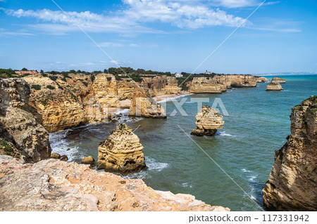 Praia da Marinha Beach among rock islets and cliffs seen from Seven Hanging Valleys Trail, Algarve, Portugal 117331942