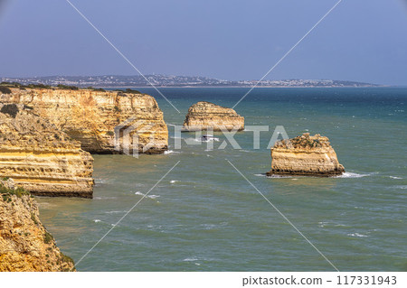 Praia da Marinha Beach among rock islets and cliffs seen from Seven Hanging Valleys Trail, Algarve, Portugal Praia da Marinha Beach among rock islets and cliffs seen from Seven Hanging Valleys Trail, Algarve, Portugal 117331943