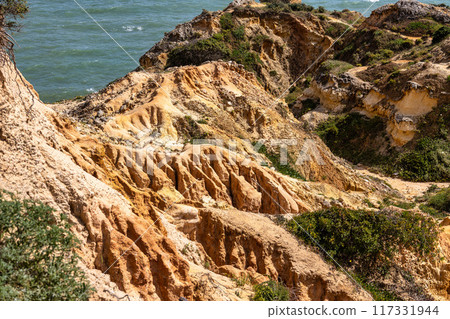Praia da Marinha Beach among rock islets and cliffs seen from Seven Hanging Valleys Trail, Algarve, Portugal 117331944