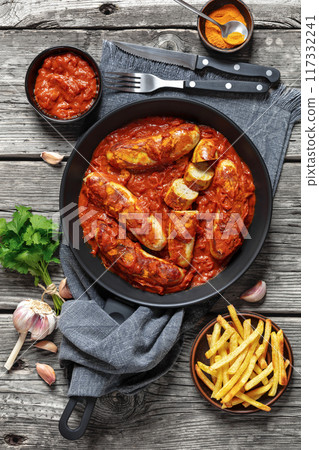 German Currywurst, pork sausages in a curry sauce 117332241