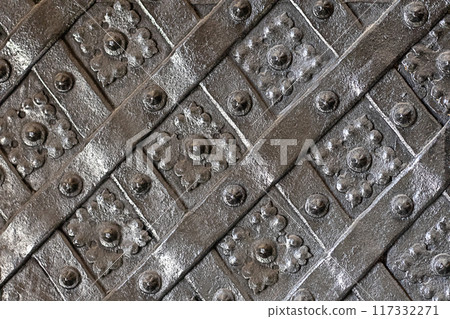 Black forged door, rhombus symmetrical texture. 117332271