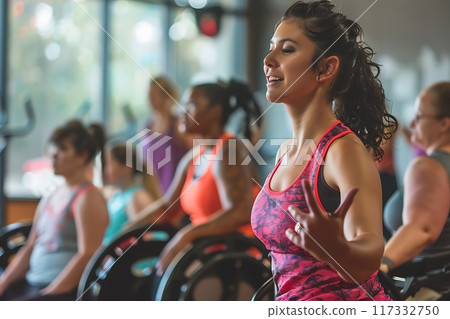 A happy group of friends at a gym class, handicapped people. 117332750