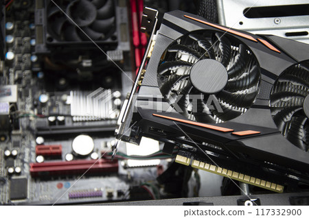 Top view of graphics card and motherboard. 117332900