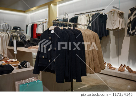 Fashionable clothes in a boutique store in shopping mall 117334145