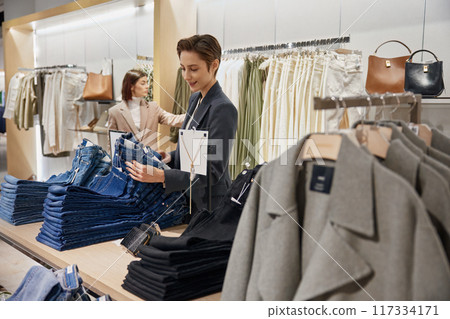 Women enjoying sale in store, shock price on new arrival concept 117334171