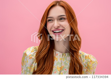 Long-haired caucasian young woman smiling and looking happy and relaxed 117334394