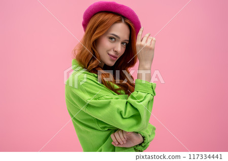 Appealing young woman in pink beret looking confident and attractive Appealing young woman in pink beret looking confident and attractive 117334441