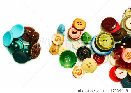 A bunches number of different multi colored tailor buttons and place for text 117334449