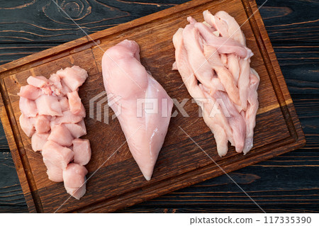Raw chicken meat fillet ( breast ) Various of cutting in form slice and cube Raw chicken meat fillet ( breast ) Various of cutting in form slice and cube 117335390