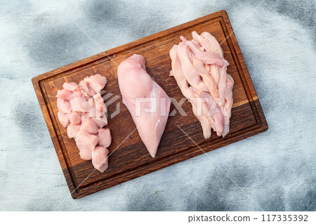 Raw chicken meat fillet ( breast ) Various of cutting in form slice and cube 117335392
