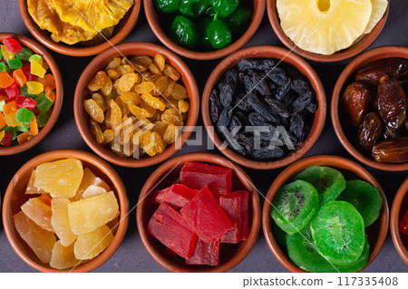 Group of dried and candied fruit in bowl 117335408