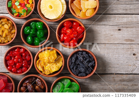 Group of dried and candied fruit in bowl 117335409