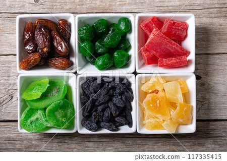 Group of dried and candied fruit in bowl Group of dried and candied fruit in bowl 117335415