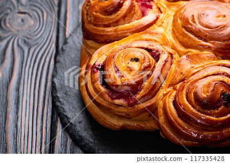 Homemade cake pie roll with cherry . Food background 117335428