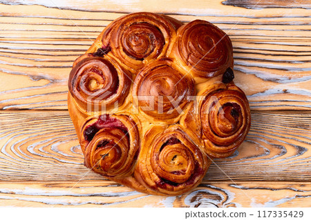 Homemade cake pie roll with cherry . Food background 117335429